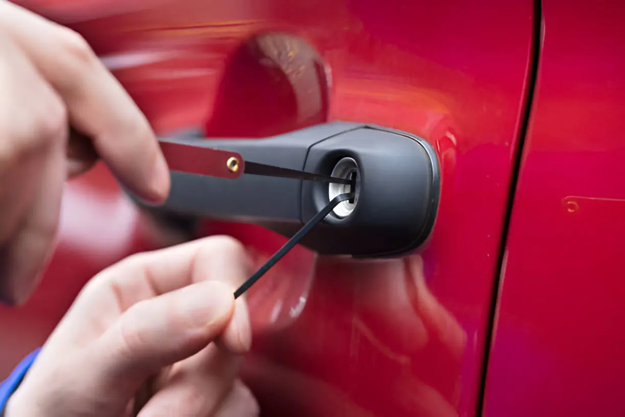 Expert car locksmith unlocking a car door safely without damage